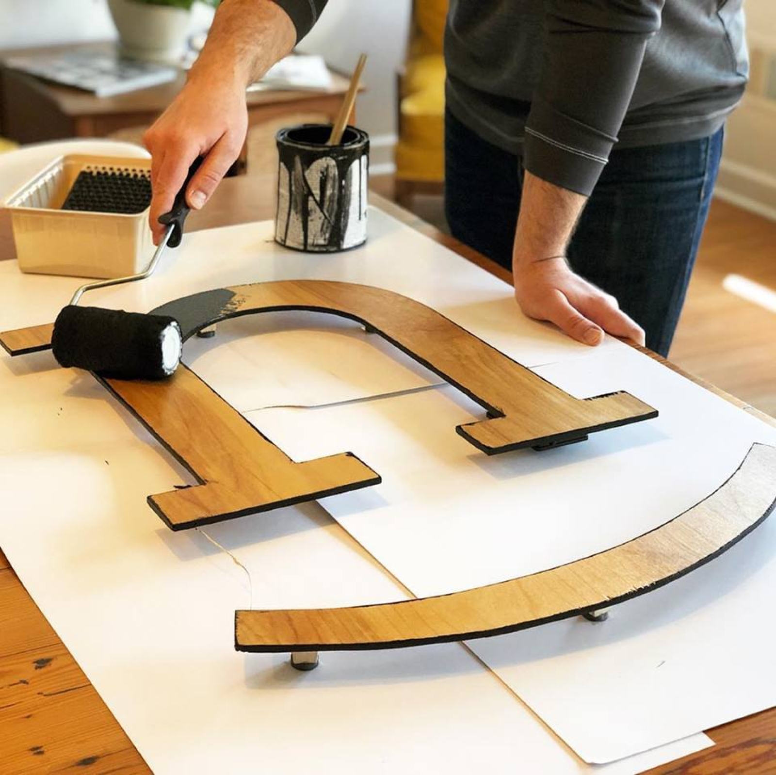 Painting wooden Nicer sign black.